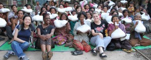 Group of people holding big bags of food