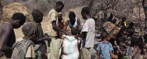 African people getting bags of food