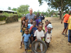 Libeeria Kids smiling with a Feeding The Nation worker