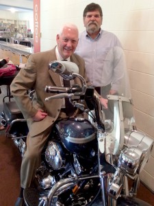 Pastor Steve Sumrall on a motorcycle