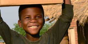 boy carrying box