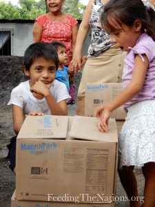 kids opening up boxes of rice