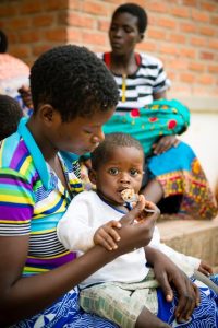 African toddler being fed